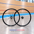 Black Miche Pistard 700c clincher track wheelset against a velodrome background