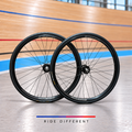 Alexrims 700c clincher track wheelset – front and rear wheels on velodrome background