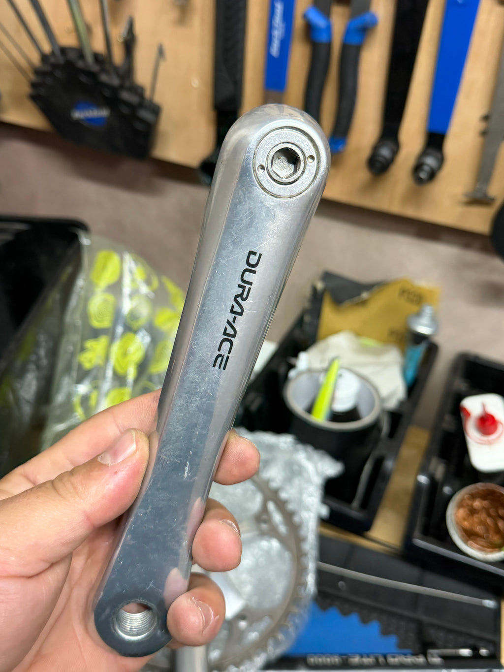 Dura-Ace logo and pedal hole on the silver crank arm