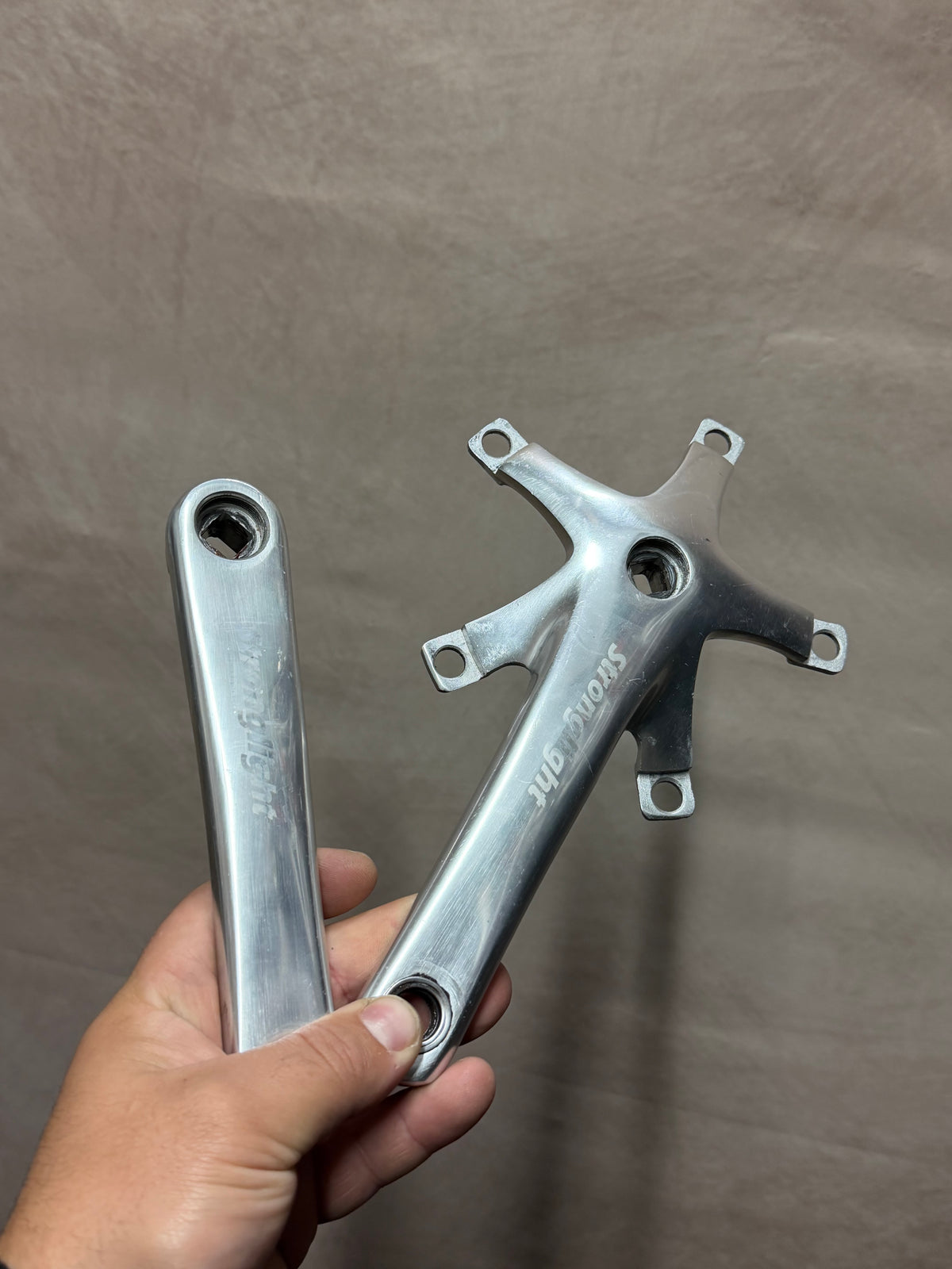 Pair of silver Stronglight track crank arms with five-arm spider