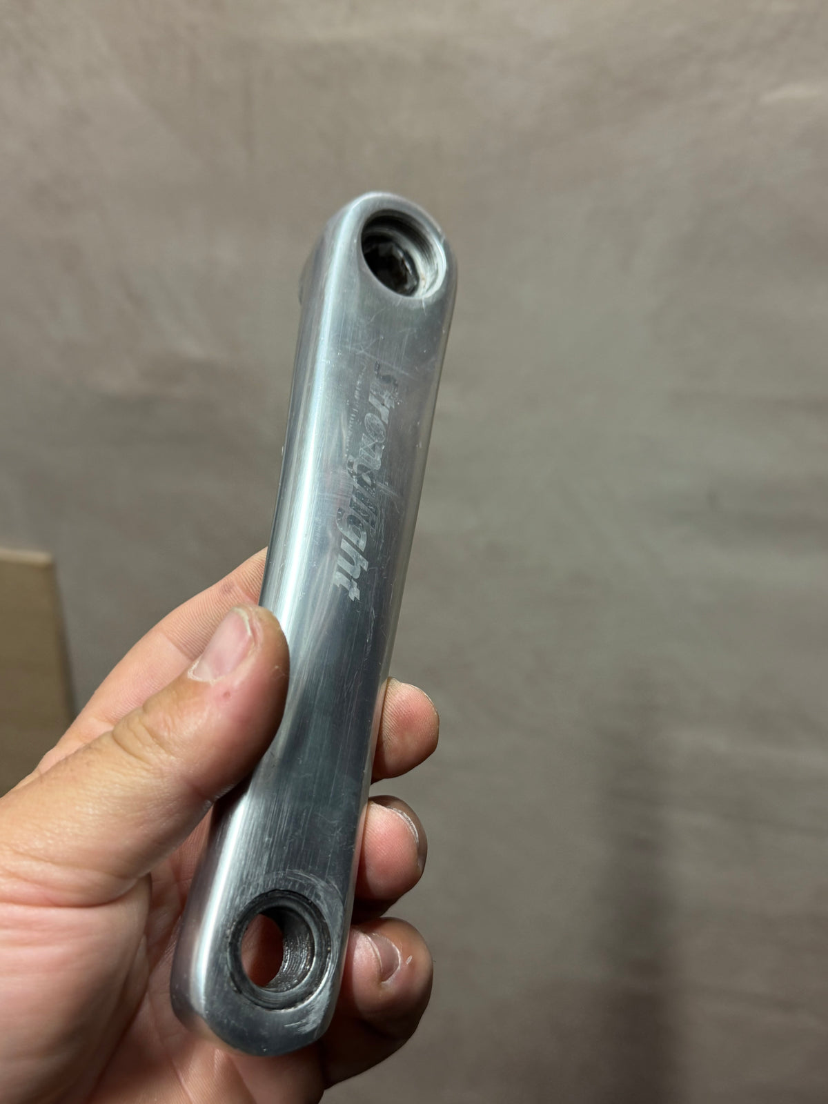 Stronglight non-drive-side crank arm with visible surface wear