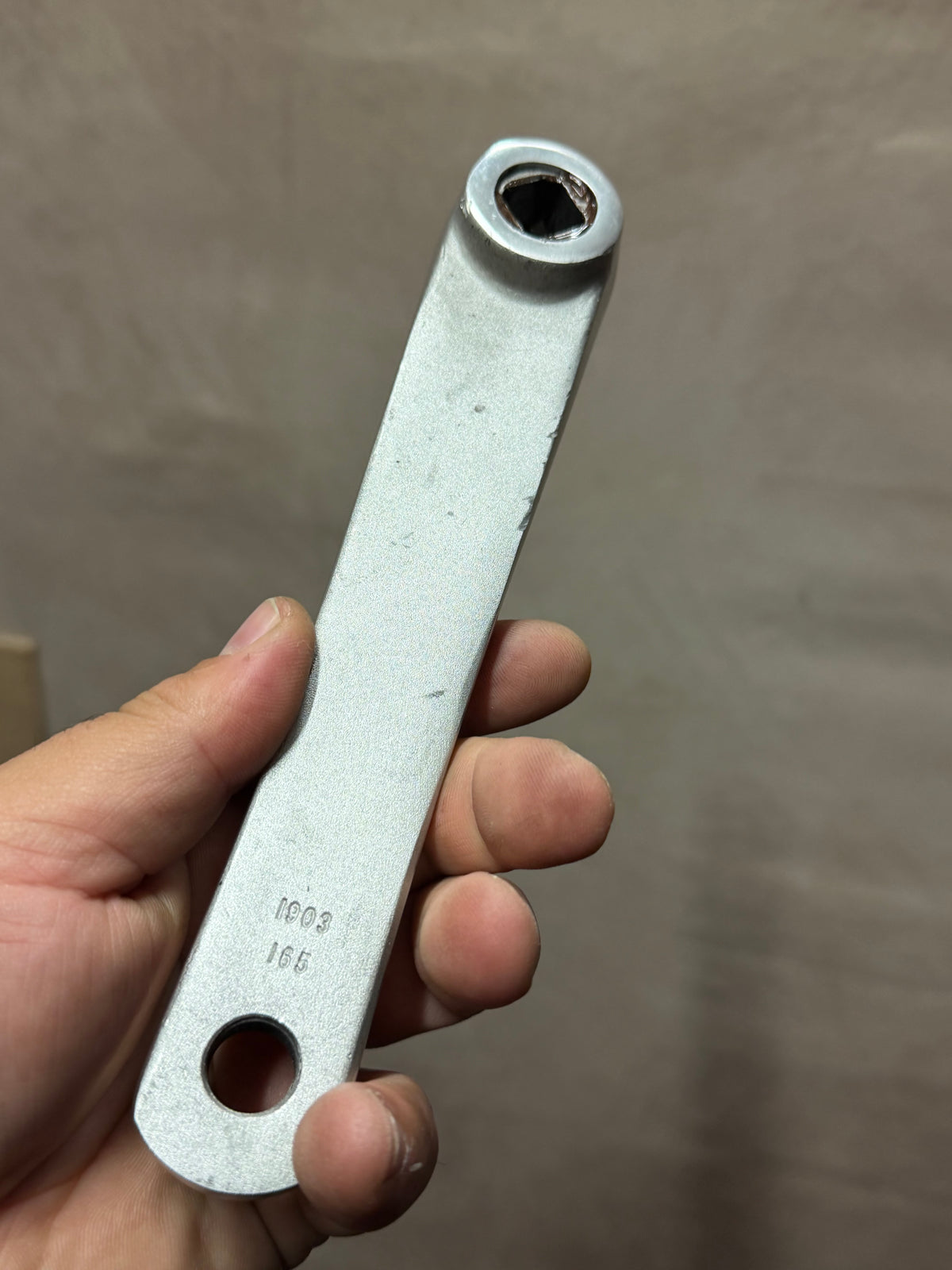 Rear face of Stronglight 165mm track crank arm showing axle and pedal holes