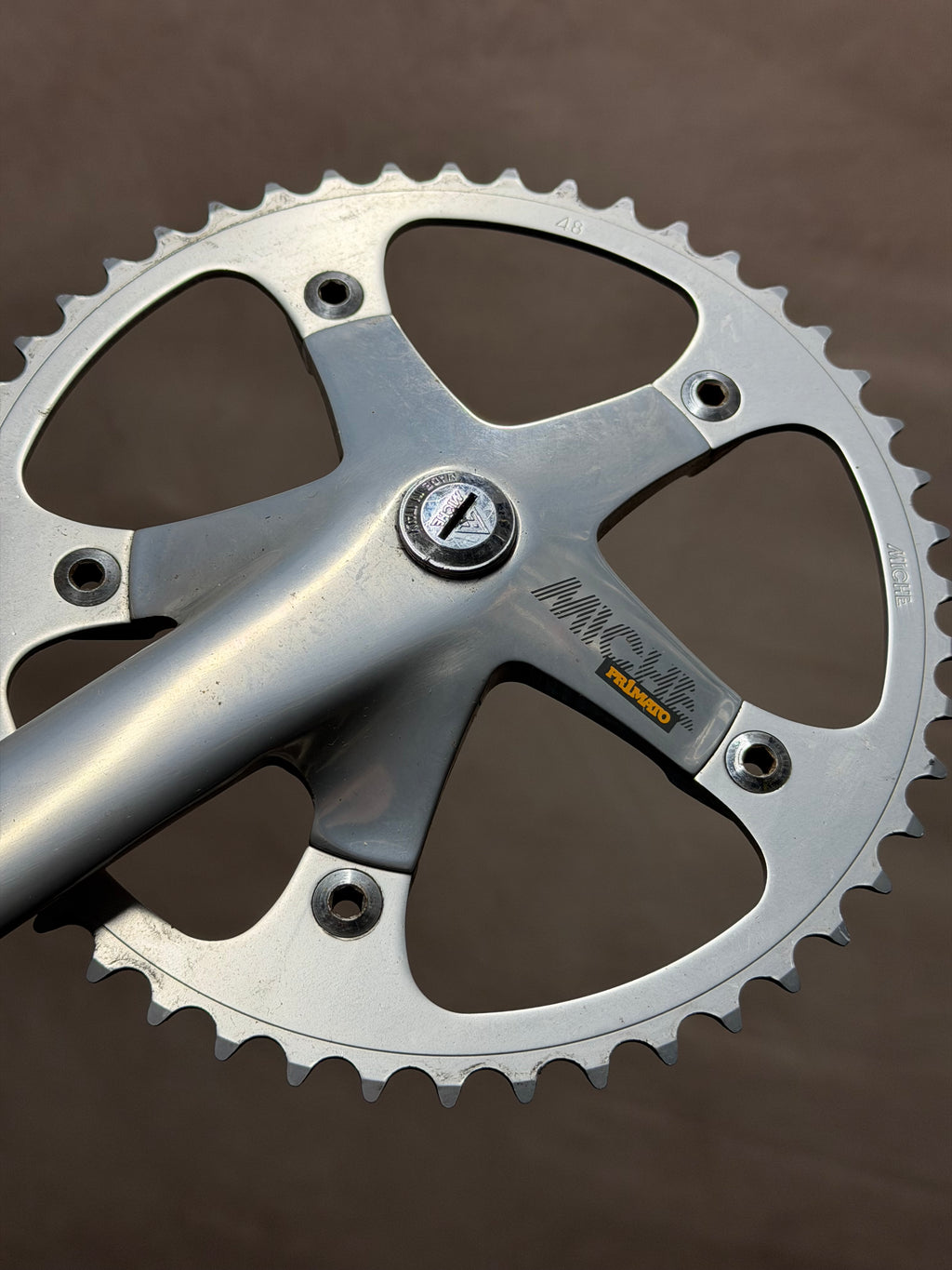 Miche logo on drive-side crank beside the chainring