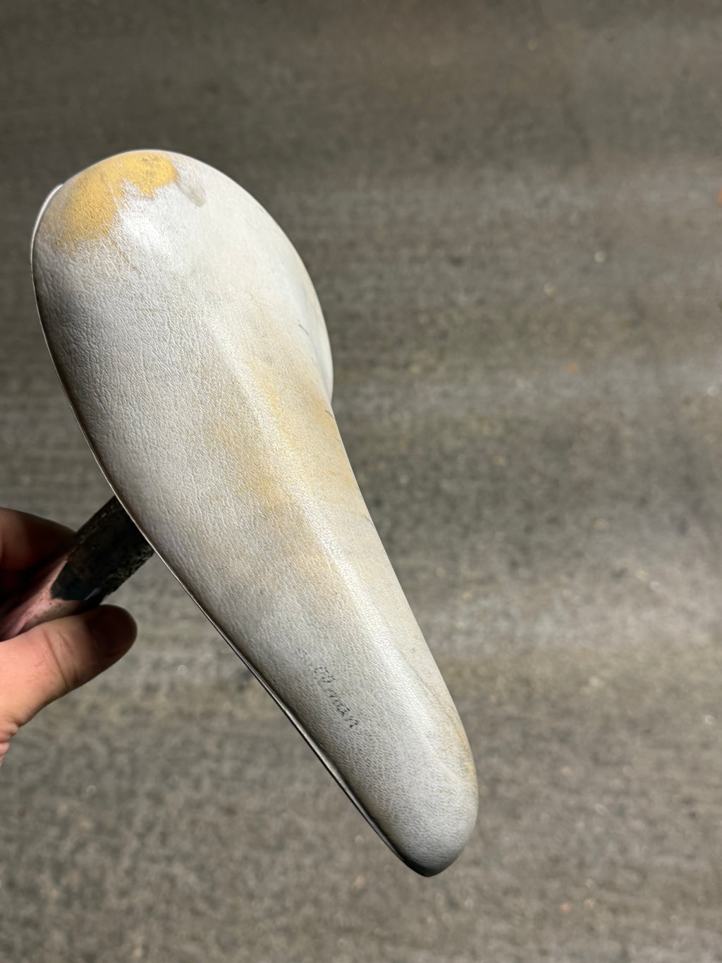 Top view of white Selle Royal retro saddle showing worn cover