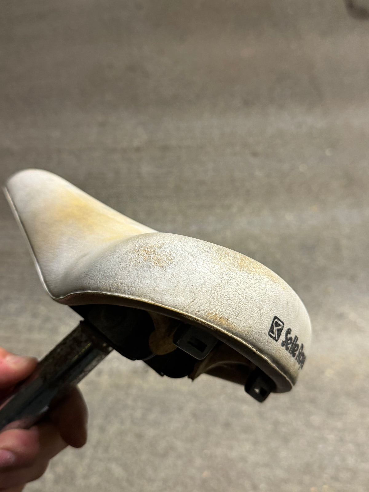 Side and rear view of white Selle Royal retro saddle