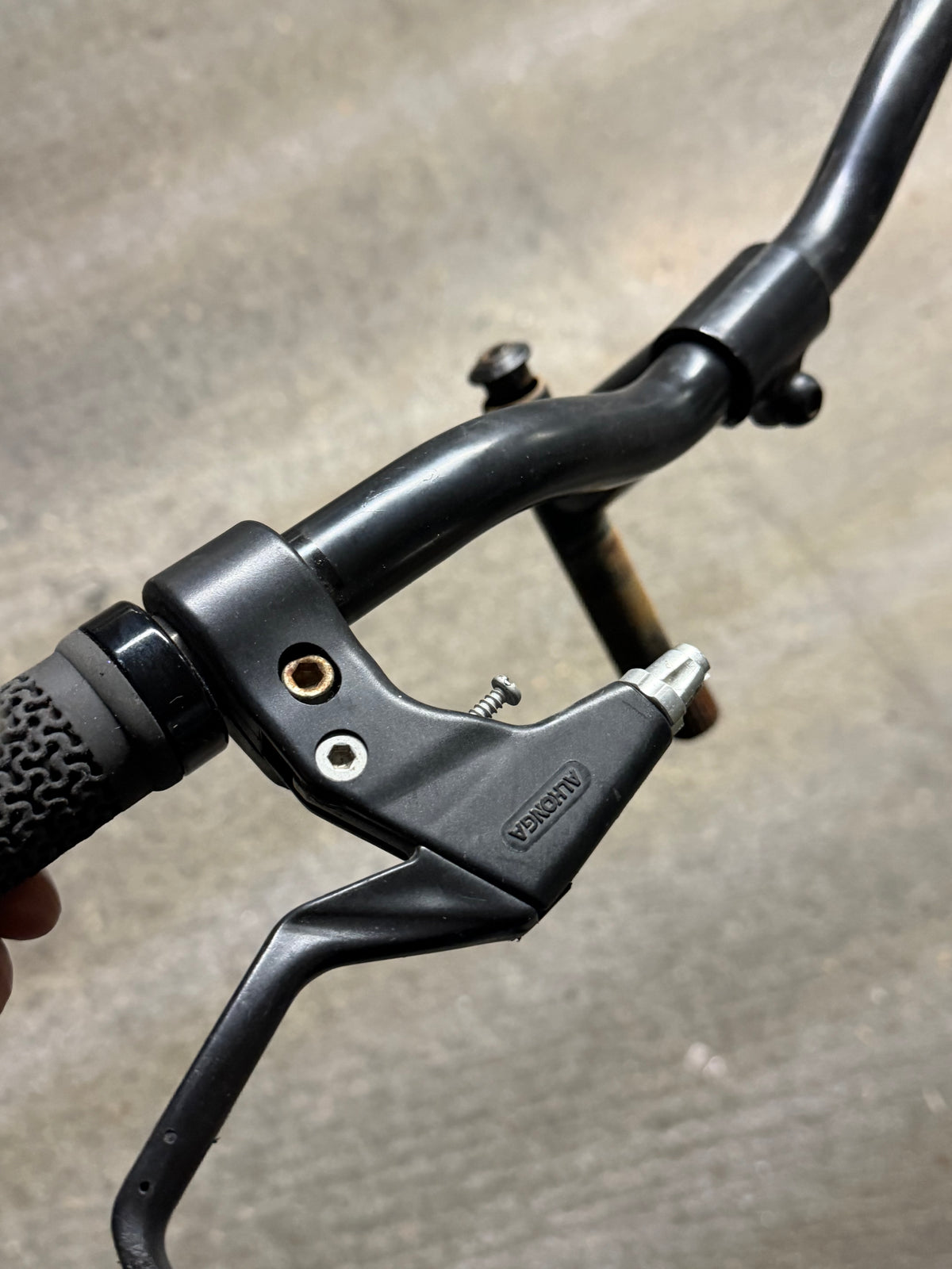 Close-up of brake lever and handlebar clamp