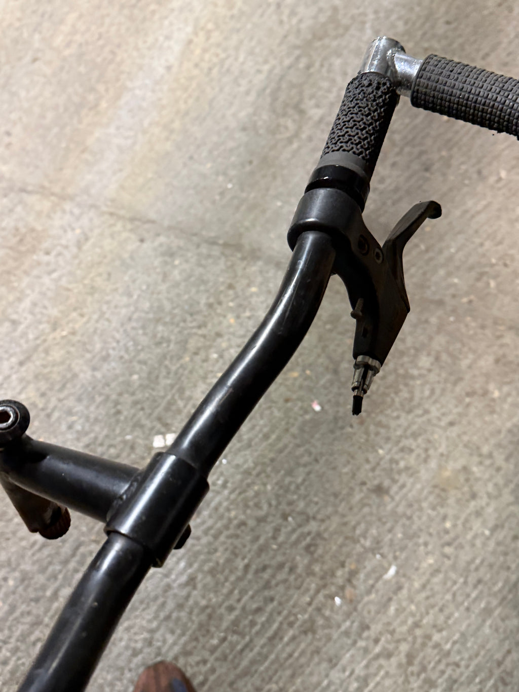Black MTB handlebar with grip and brake lever