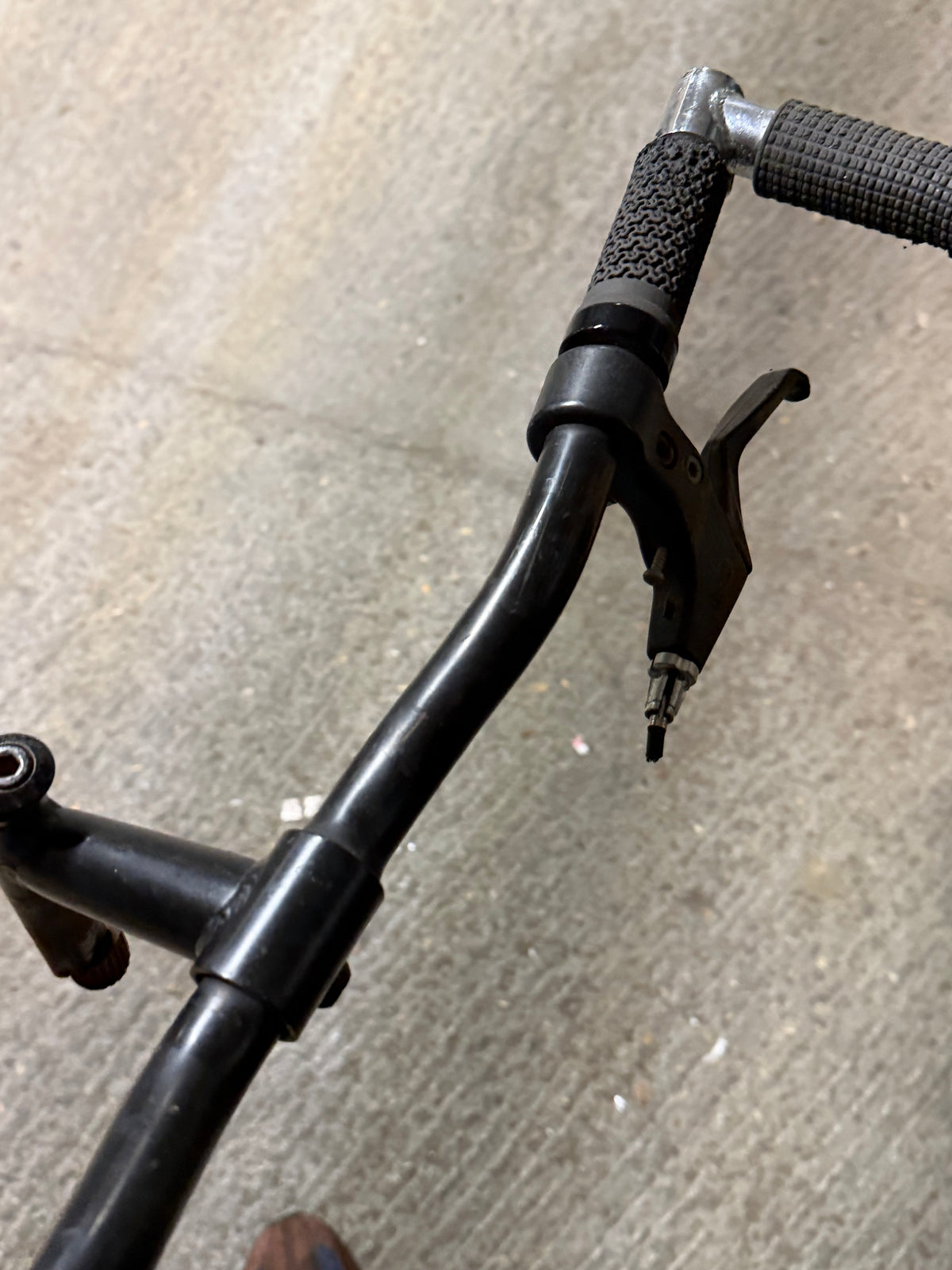 Black MTB handlebar with grip and brake lever