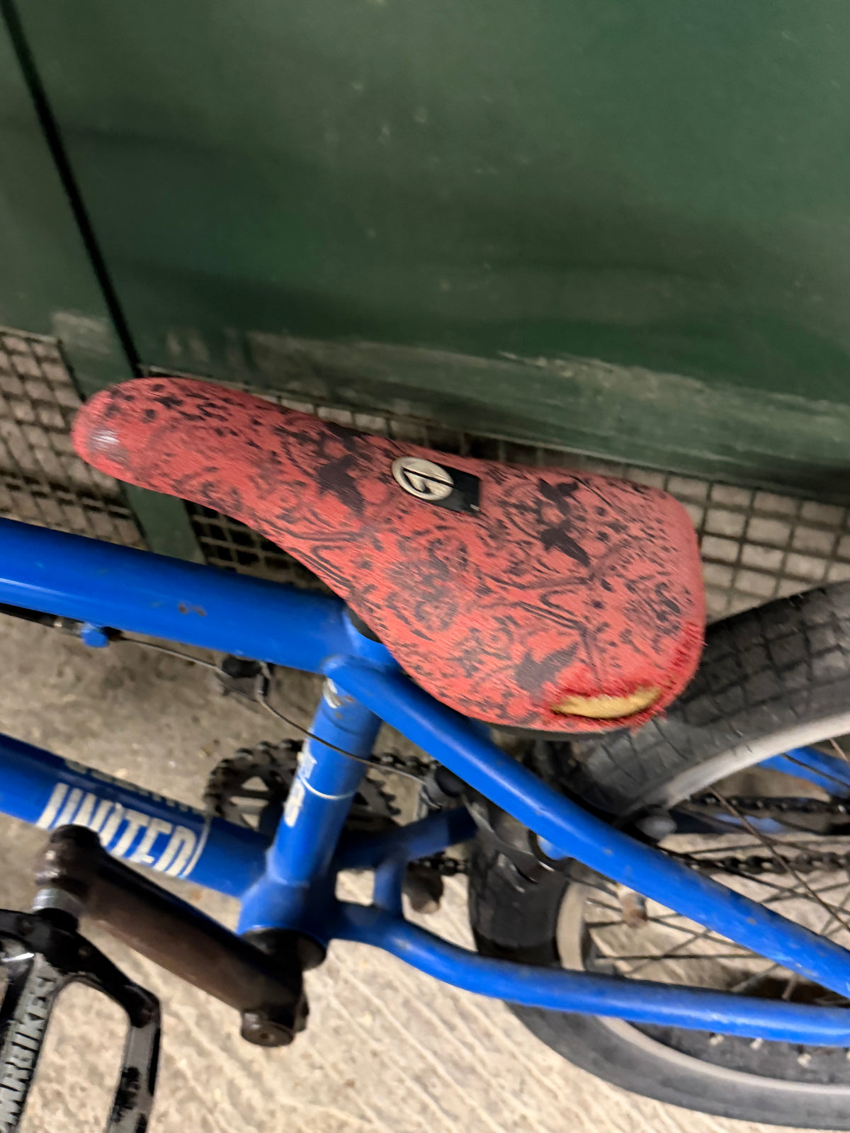 Red patterned saddle on blue Sunday BMX bike