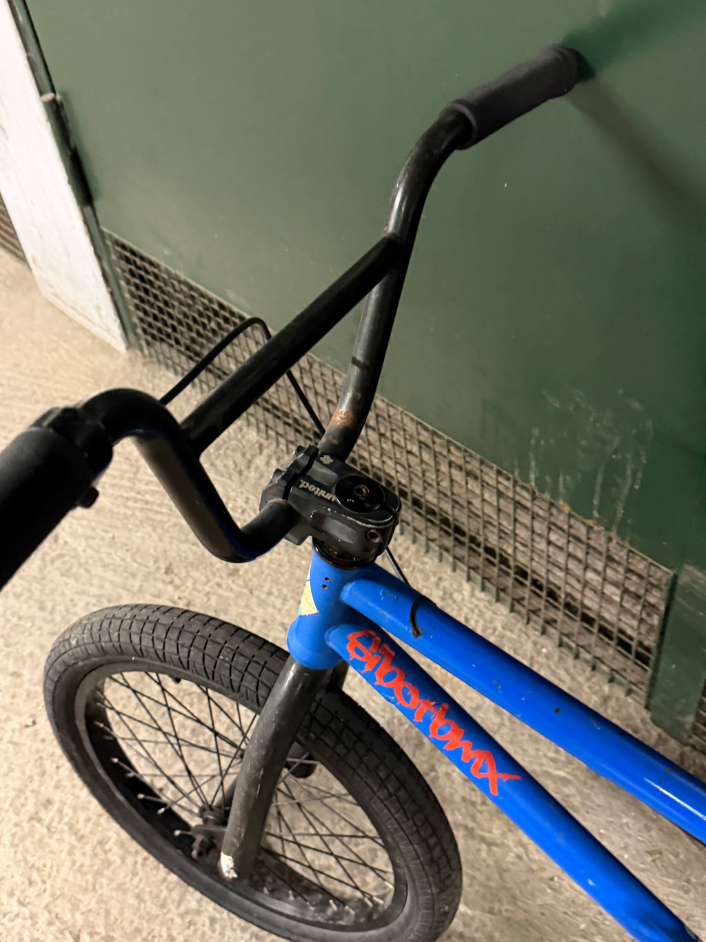 Blue Sunday BMX head tube and black handlebars