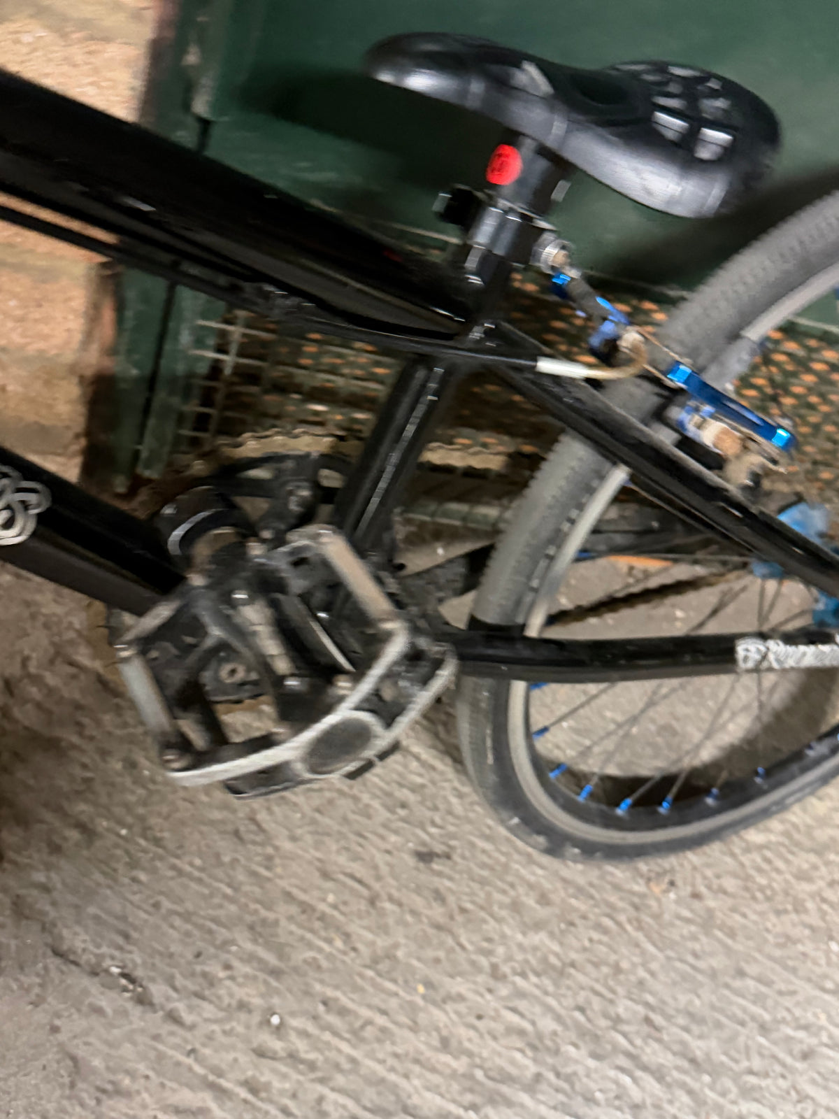 Rear brake and chainstay area of black kids' BMX