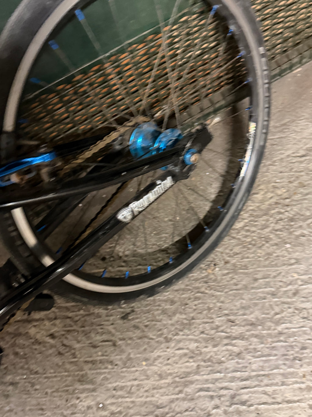 Rear wheel, chain and blue rear hub of Factory Team Bikes BMX