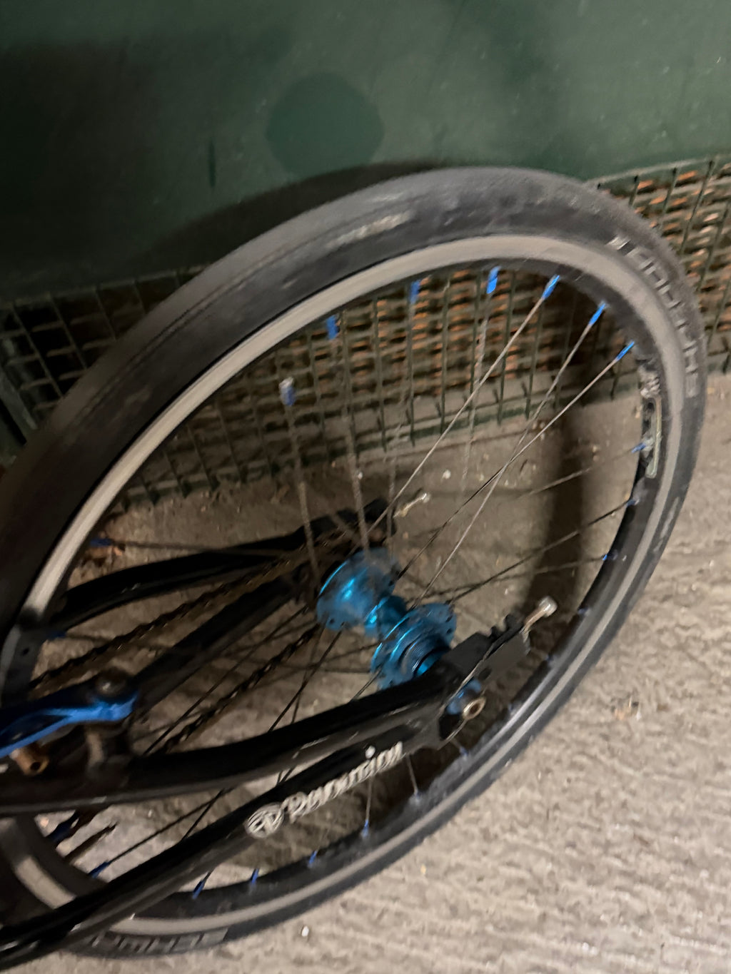 Rear wheel and blue hub of Factory Team Bikes BMX