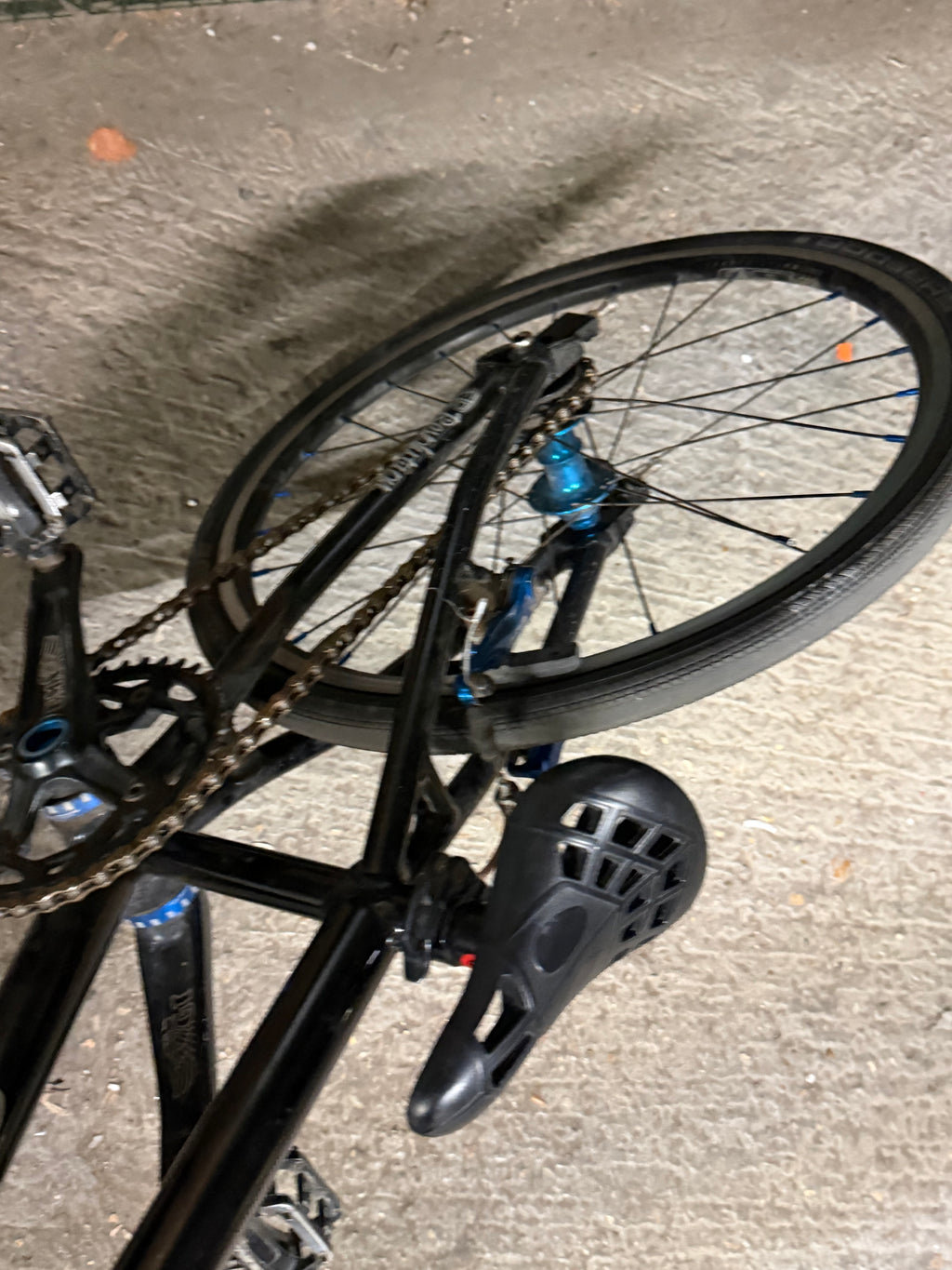 Rear frame, saddle and wheel of black Factory Team Bikes BMX