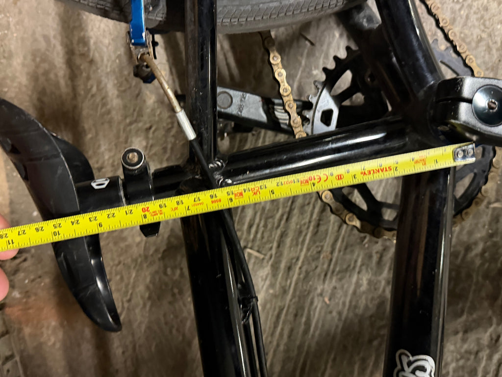 Tape measure across Factory Team Bikes BMX frame