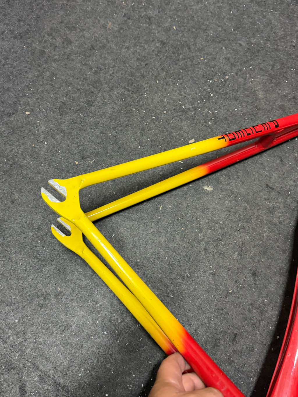 Custom red and yellow aluminium track frame – yellow rear stays and track dropouts