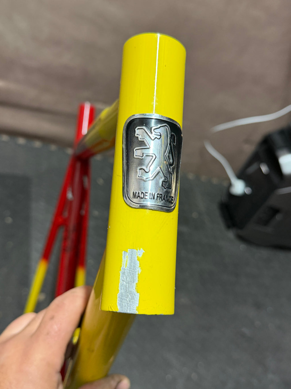 Custom red and yellow aluminium track frame – front of head tube and badge