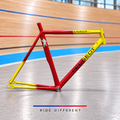 Custom red and yellow aluminium track frame – side view on velodrome background, sold damaged