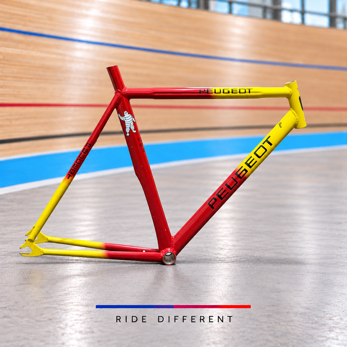 Custom red and yellow aluminium track frame – side view on velodrome background, sold damaged